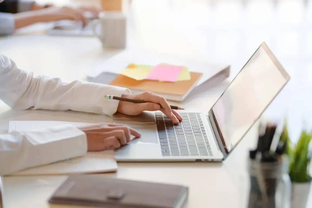 Confident student in the United States studying with a CASAS Practice Test and reviewing a CASAS Practice Test PDF on a desk Confident student in the United States studying with a CASAS Practice Test and reviewing a CASAS Practice Test PDF on a desk